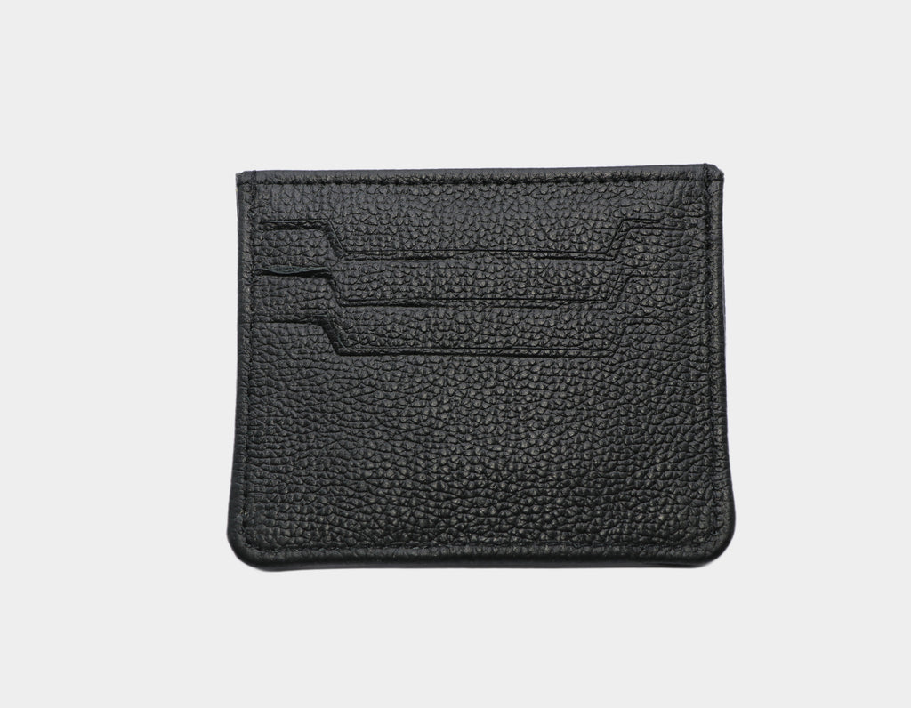 Black leather cardholder on a light gray background